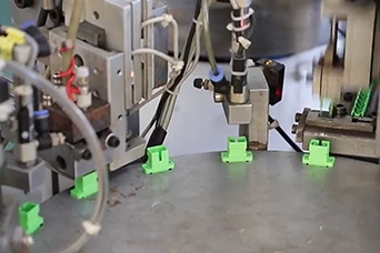 Fiber optic adapter production and testing